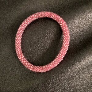 Sashka bracelet stretches up to 7  1/2 light pink.